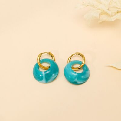 Boucles d'oreilles dorées avec pendentifs pierre bleue