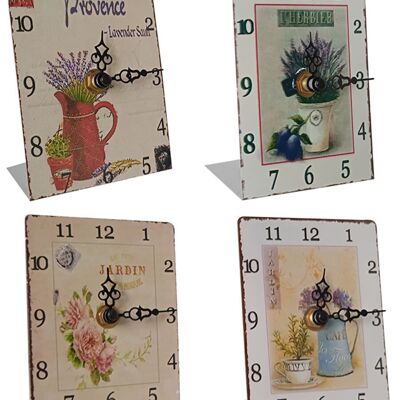 Metal table clock with corner base in various designs. Dimensions: 8.5x12x4.5cm (base)