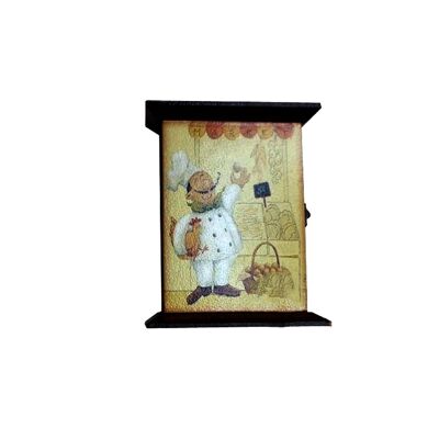 Wooden opening key case with a central character a cook.  Dimension: 17x5x20cm
