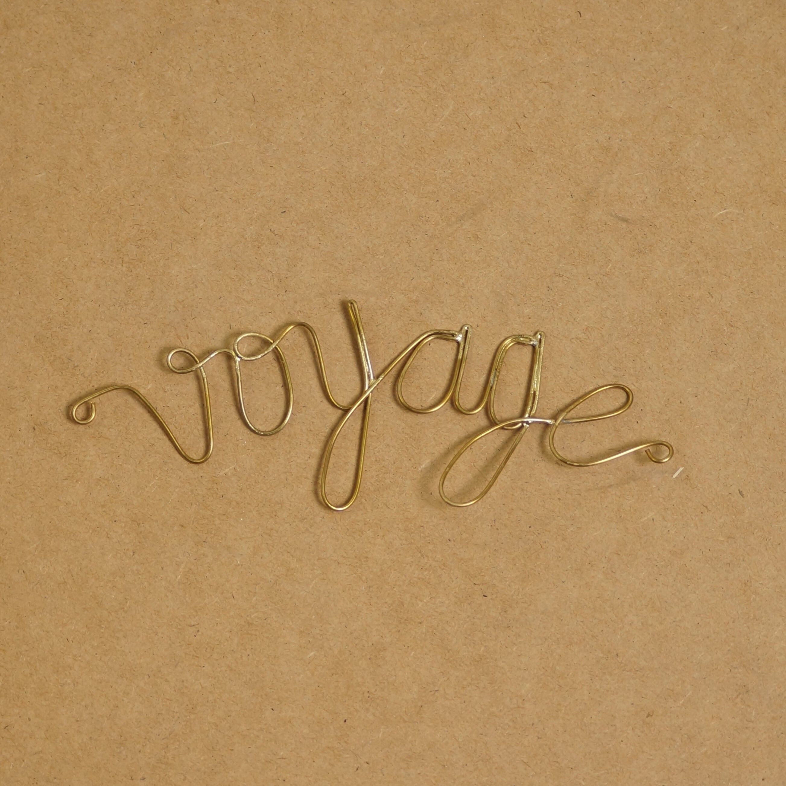 Parola di ottone dorato - Viaggio