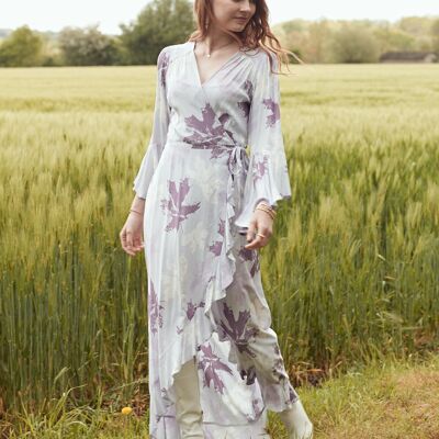 Asymmetrical long dress with ruffles and flared sleeves