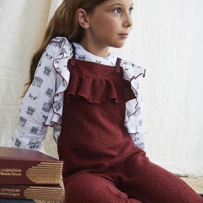 Girl's maroon knit dungarees with decorative ribbon straps