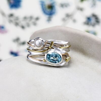 ANELLO DI RICHIESTA CON TOPAZIO AZZURRO E PERLA D'ACQUA DOLCE