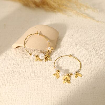 Hoop earrings adorned with leaf pendants