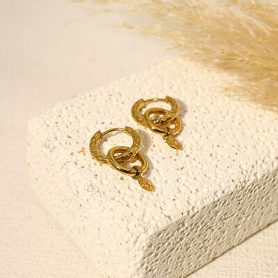 Golden mini hoop earrings linked together
