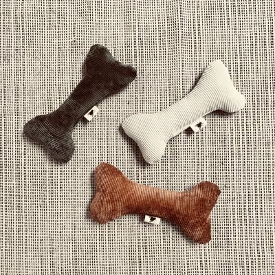 Animal toy cuddly bones with rattle made of wide corduroy