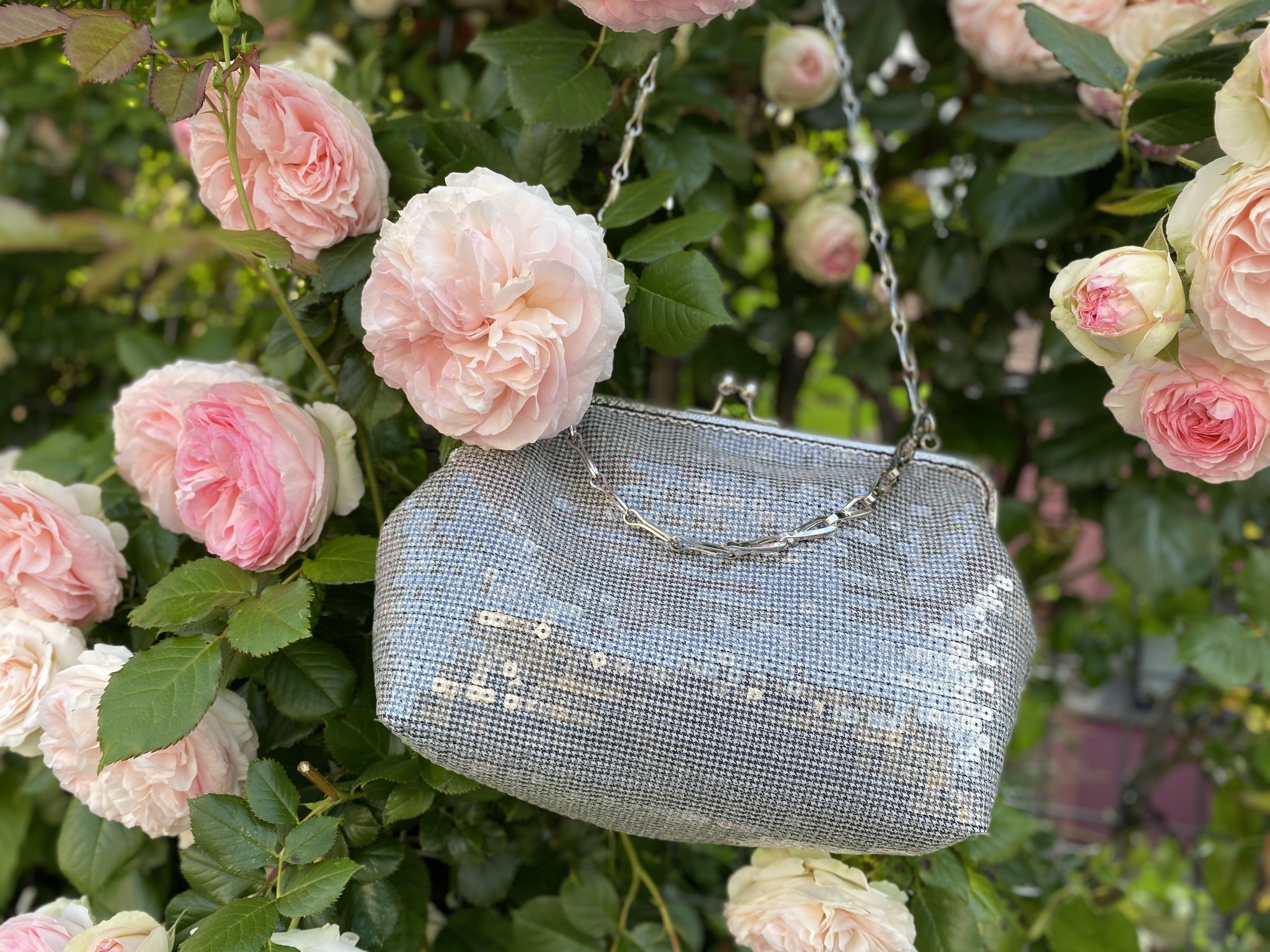 ROXY retro style sequin bag - silver strap, worn on the shoulder.