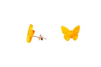 Boucles d'oreilles ambre papillon beurre 1