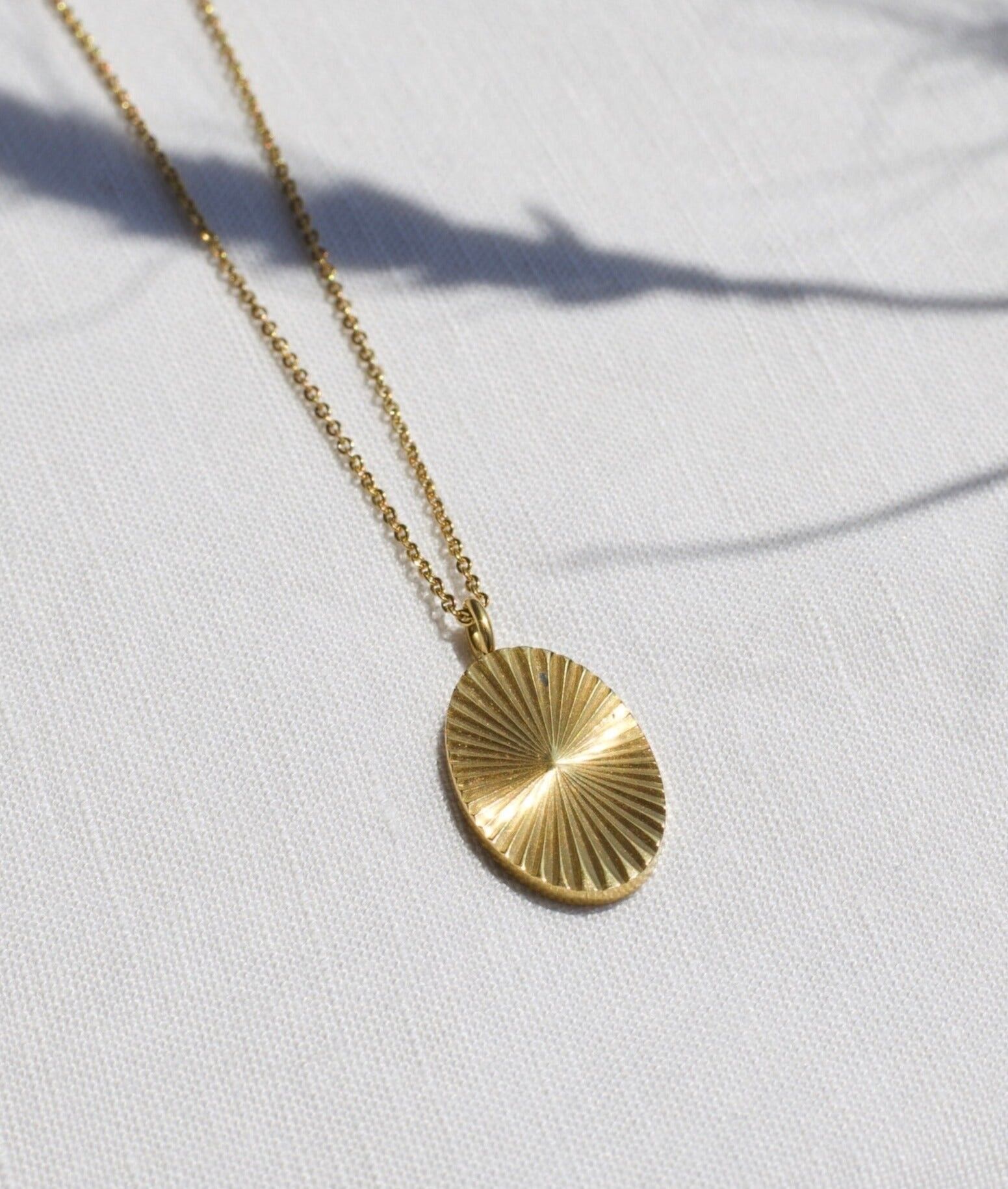 Jerod - Oval Sunburst Charm Necklace