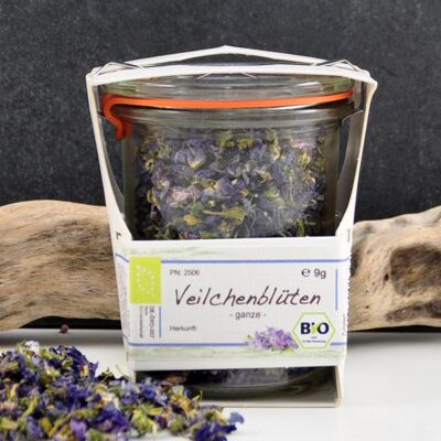 Fiori di violetta biologici in un barattolo di vetro