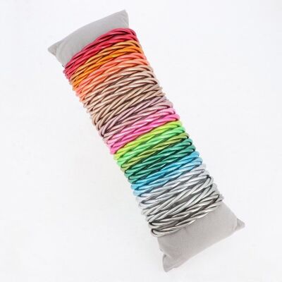 Kit of 28 multicolored twisted Buddhist rods. Cushion offered.