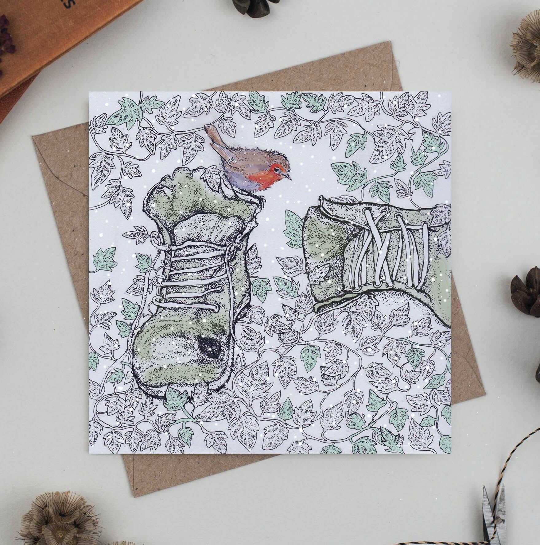 Biglietto d'auguri con pettirosso sugli stivali