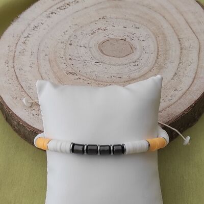 Hematite adjustable cord bracelet and white and golden orange polymer beads