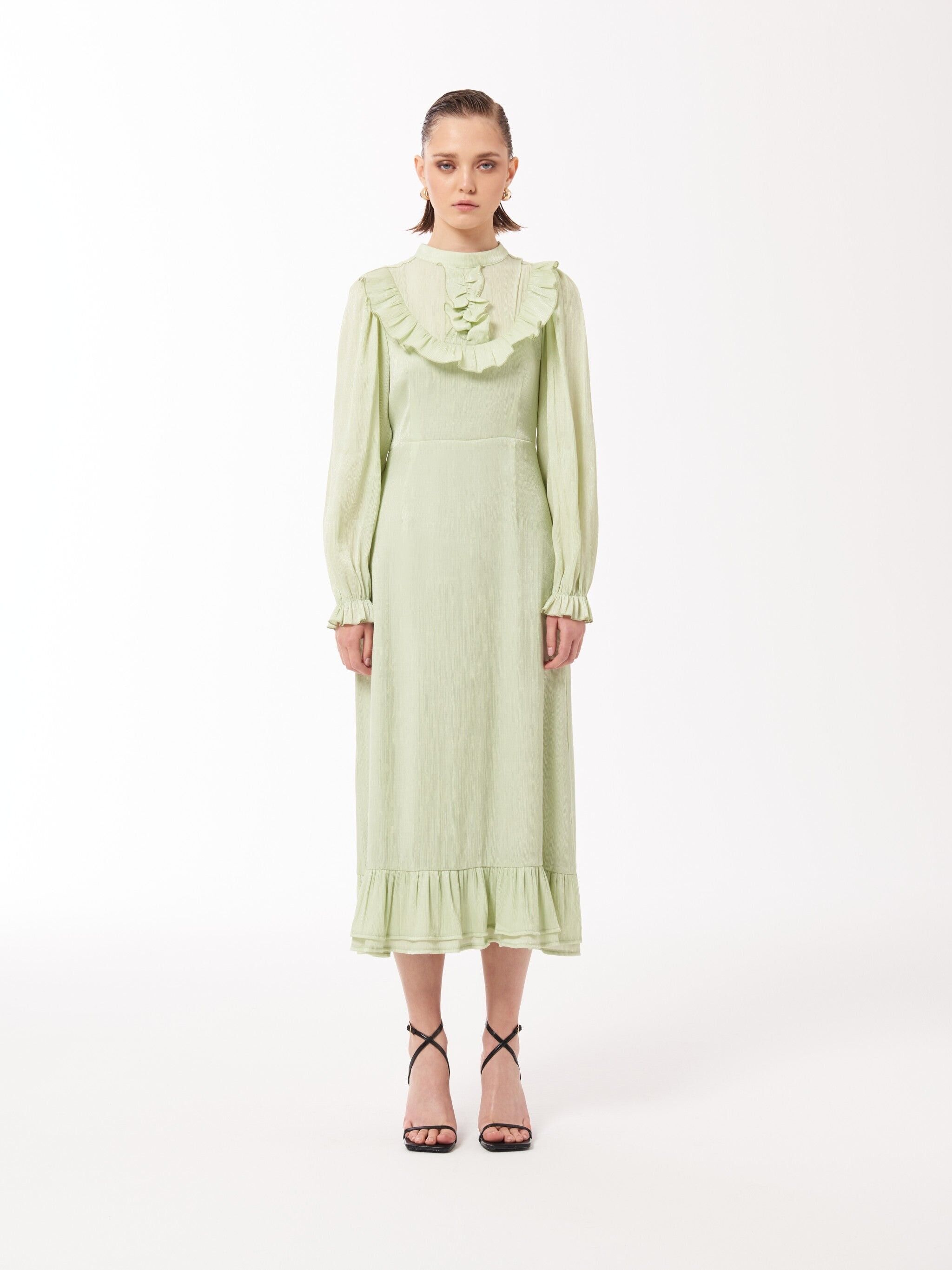 Abito longuette con volant in verde con stemma del surf