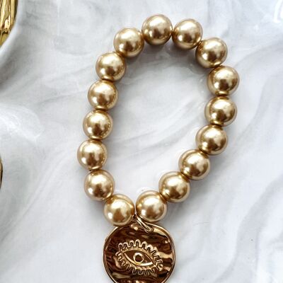 Grande braccialetto di perle d'oro con moneta occhio