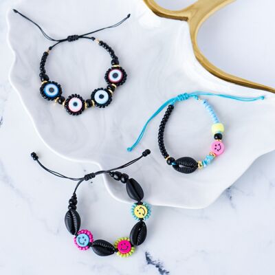 Black bracelets with shells and evil eyes