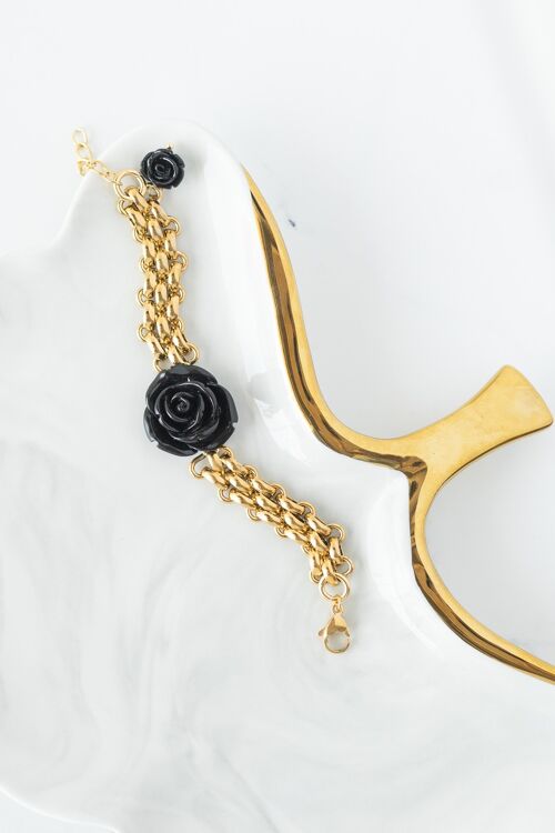 Gold bracelet with black rose