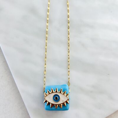 Gold chain with blue bead evil eye
