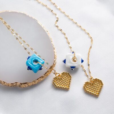 Gold heart with glass protection eyes
