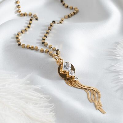 Long gold necklace with white crystal pendant