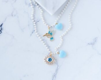 Colliers de charme rosario de perles avec oeil et oiseau 1