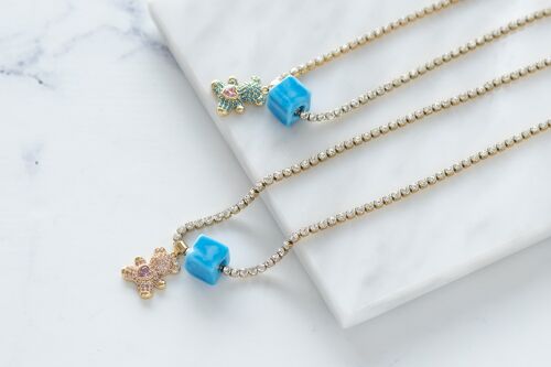 Steel tennis gold chain with teddy bear and blue protection bead