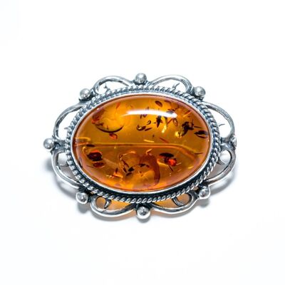 Broche ovale classique en ambre avec cadre