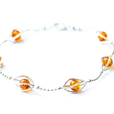 Bracelet moderne avec sphères d'ambre en cage
