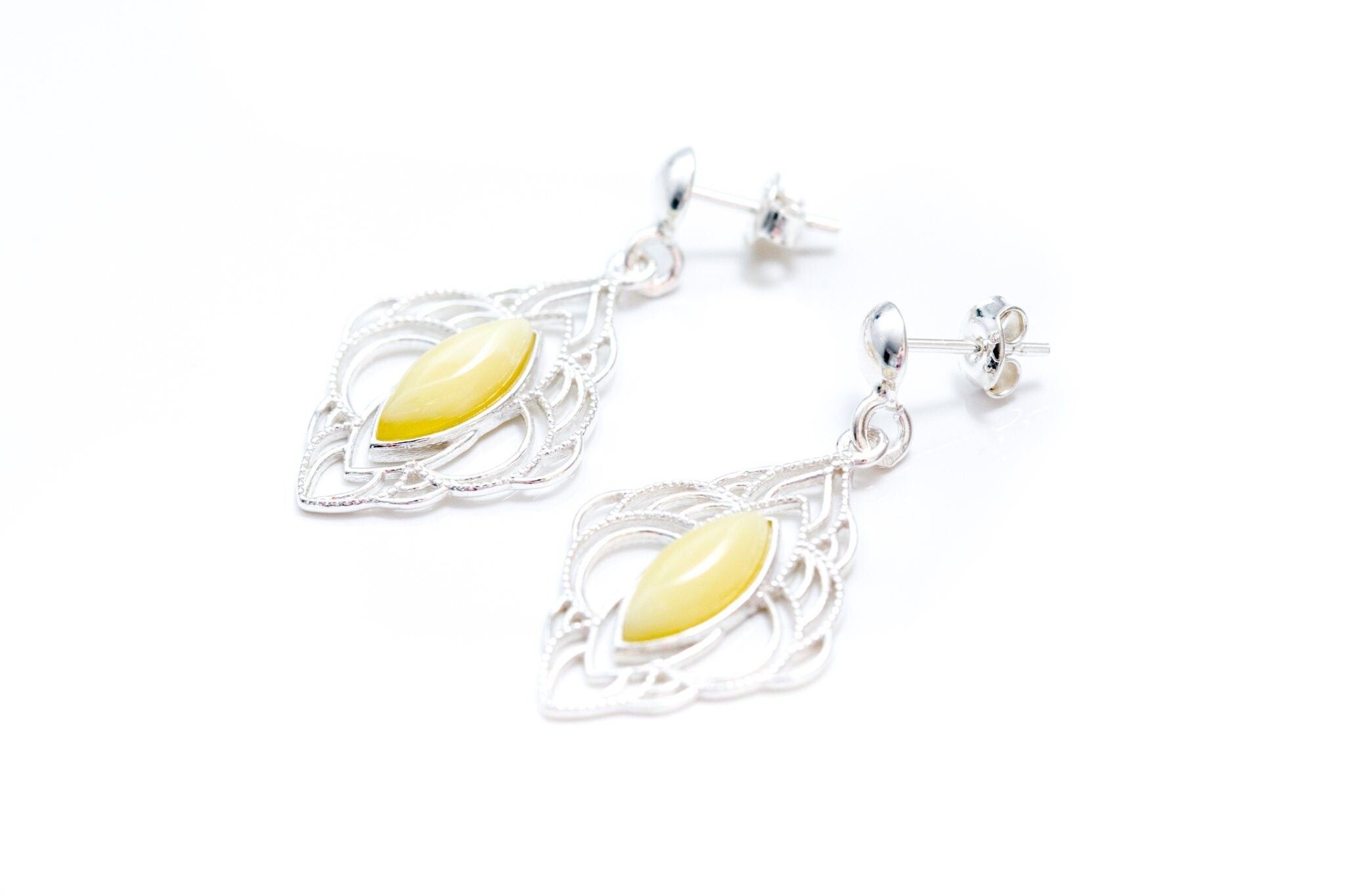 Pendientes de ámbar caramelo con marco de araña