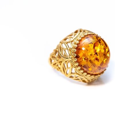 Anello polsino in ambra cognac con design in oro