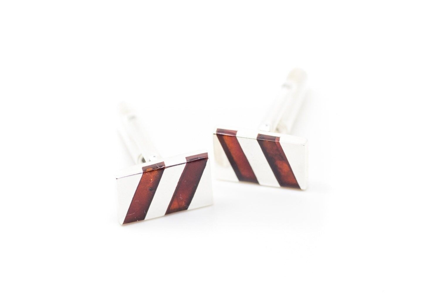 Gemelli piatti in ambra e argento