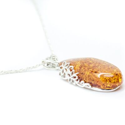 Ciondolo lungo con disegno floreale color ambra
