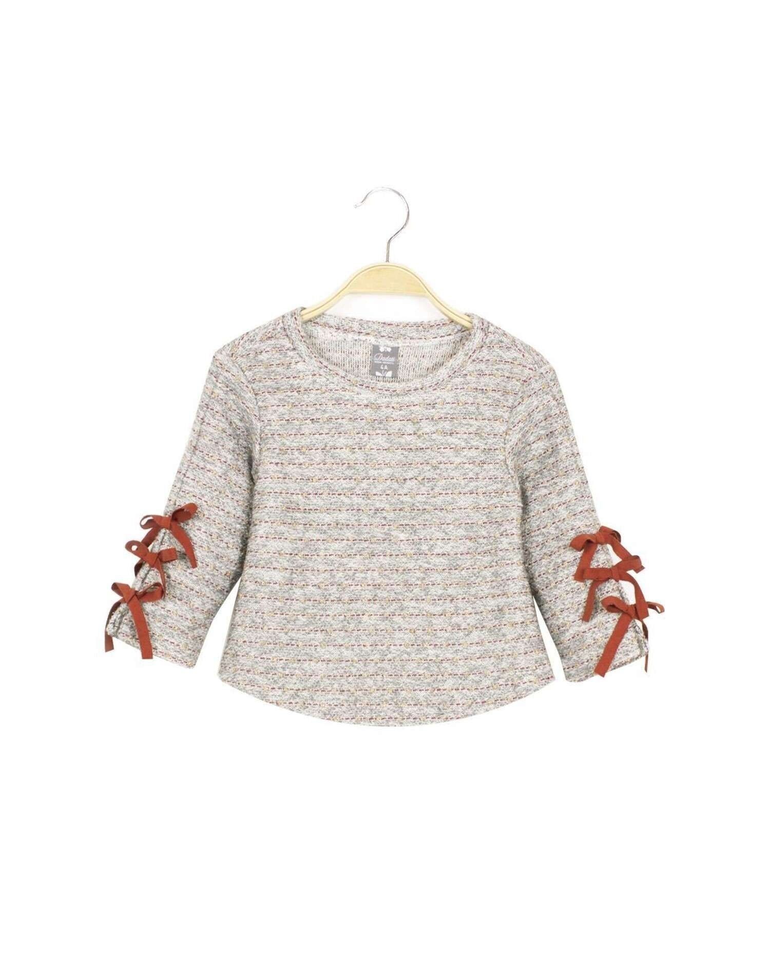 Maglia grigia da bambina con fiocchi