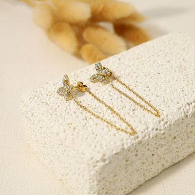 Butterfly earrings with chain linked to the tip