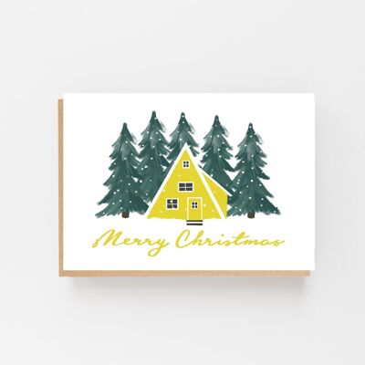 Casa amarilla escandinava "Feliz Navidad"