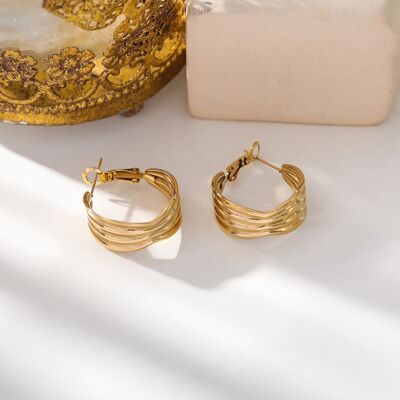 Golden hoop earrings with lines