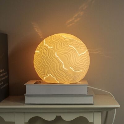 Porcelain lamp in a sphere shape with a pearls design