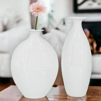 white cracked vases
