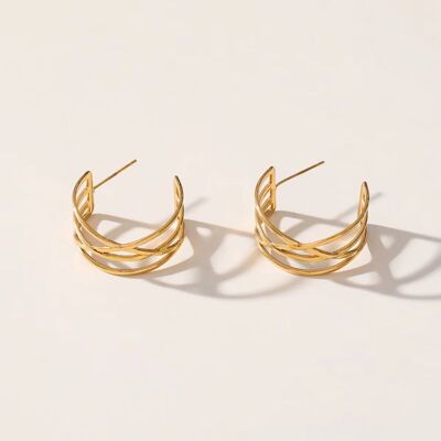 Goldene Ohrringe mit gekreuzten Linien