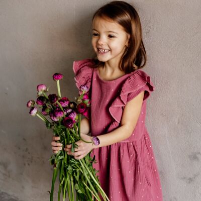 Vestido de muselina con volante y pequeña tapeta de botones