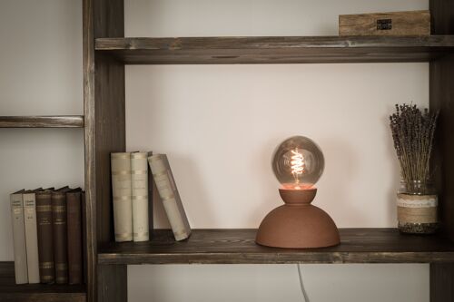 Minimalist red clay table lamp.