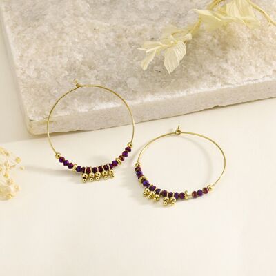 Gold hoop earrings with blue crystals