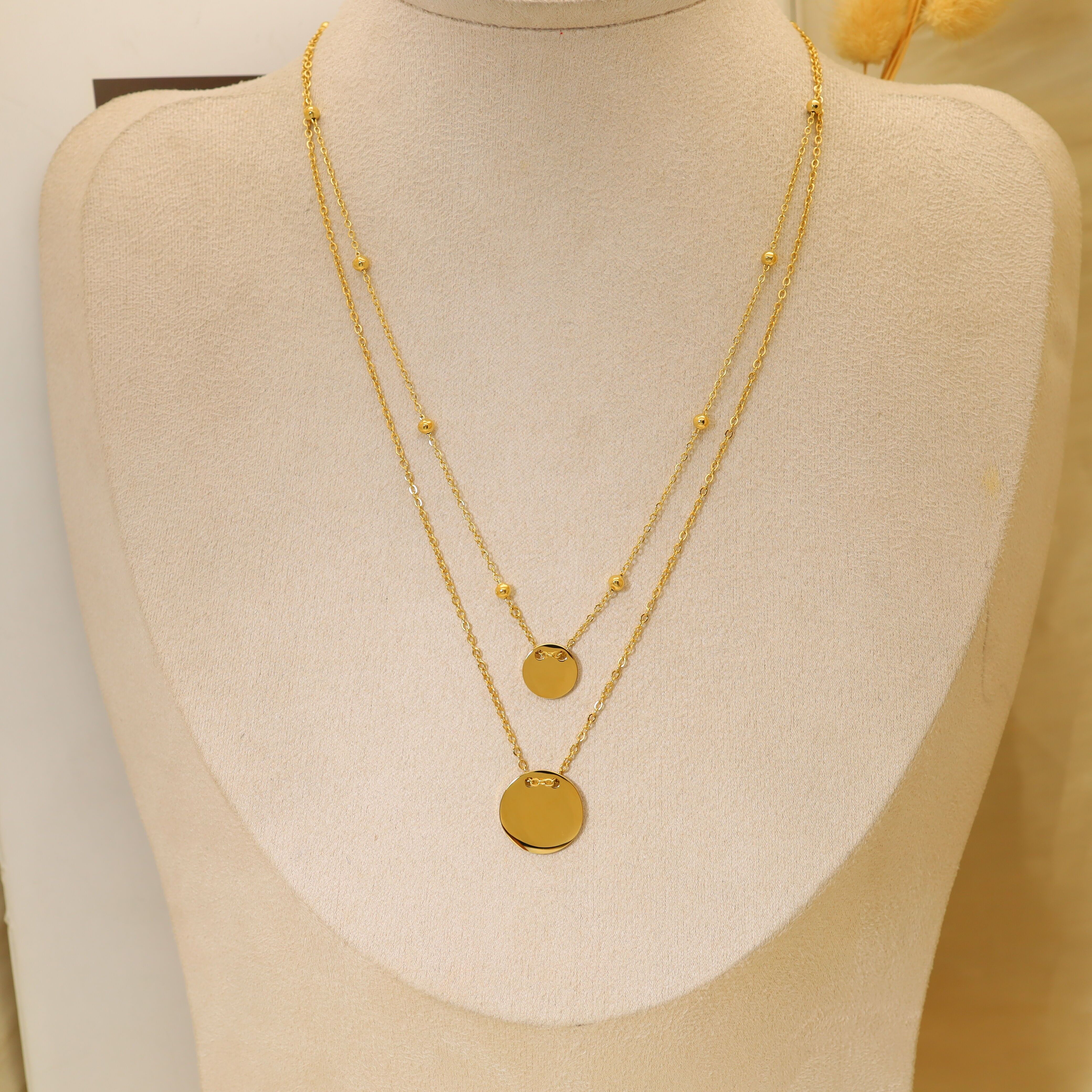 Collana a doppia catena con pendenti tondi