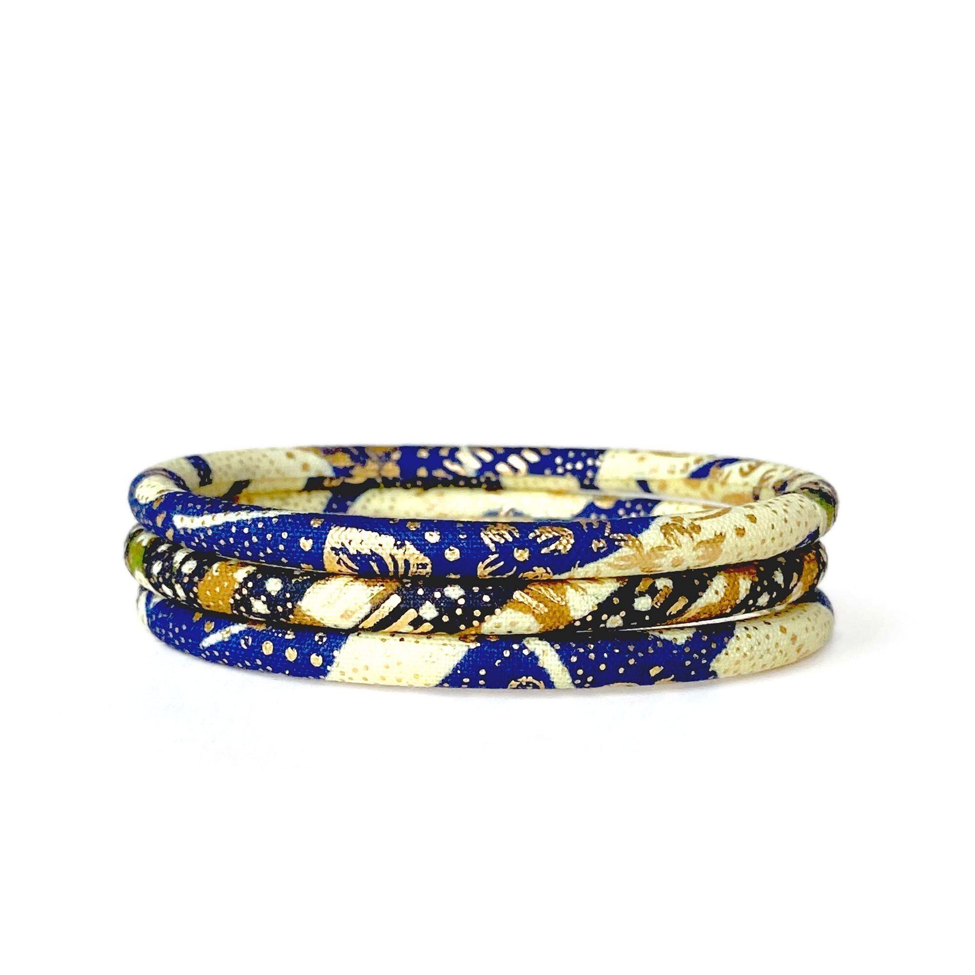 Braccialetti in cera ecru/blu navy/verde/oro