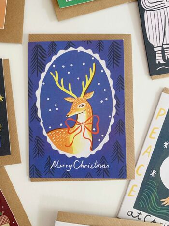 Carte de Noël encadrée de cerfs