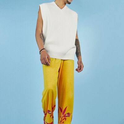 Wide yellow pants with fuchsia flower at the bottom