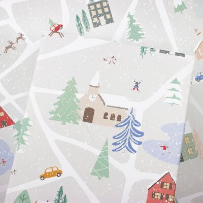 Papel de regalo con paisajes invernales hecho de papel reciclado