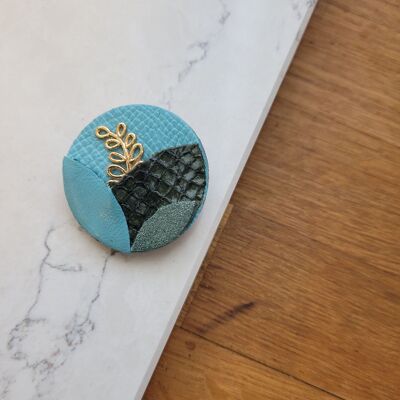 Delicate turquoise leaf brooch in recycled leather and gold plated