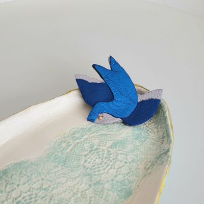 Electric blue swallow brooch in recycled leather and gold plated