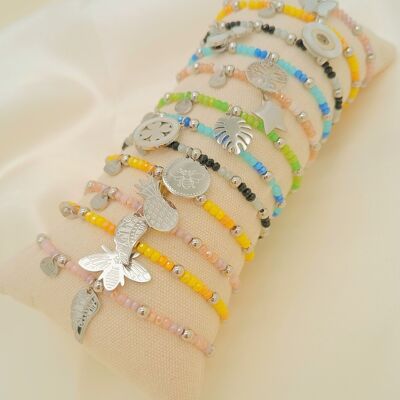 Set of colorful elastic bracelets with silver pendants